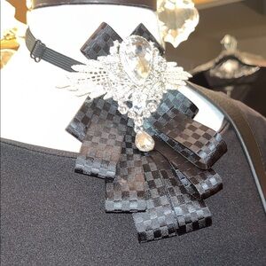 Elegant Black Checkered Brooch with Crystal Accents